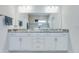 Bathroom featuring a double vanity with granite countertops, white cabinetry, and modern fixtures at 221 Seaworthy St, Summerville, SC 29486