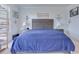 Cozy bedroom with a large bed, a nightstand with a lamp, and decorative airplane models on the walls at 221 Seaworthy St, Summerville, SC 29486