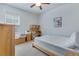 Bright bedroom with ceiling fan, natural light, a twin bed, desk, and dresser at 221 Seaworthy St, Summerville, SC 29486