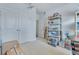 Bedroom with white double door closet, and shelving filled with model airplanes and boxes at 221 Seaworthy St, Summerville, SC 29486
