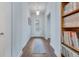 Hallway featuring wood floors, an area rug, a light fixture, and a bookcase at 221 Seaworthy St, Summerville, SC 29486