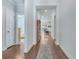 Hallway featuring wood floors, an area rug, and white crown molding at 221 Seaworthy St, Summerville, SC 29486