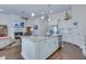Bright, open kitchen with stainless steel appliances, island with marble countertop, and open view of living room at 221 Seaworthy St, Summerville, SC 29486