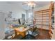 Office space featuring desk, wood floors, shelves, natural light, and neutral walls at 221 Seaworthy St, Summerville, SC 29486