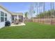 Large backyard with green lawn and a patio dining set at 224 Hayworth Rd, Summerville, SC 29486