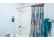 Bathroom with a white shower and a shower curtain with dark blue and brown patterns at 224 Hayworth Rd, Summerville, SC 29486