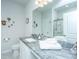 Bright bathroom with granite countertop vanity and a glass-enclosed walk-in shower in the background at 224 Hayworth Rd, Summerville, SC 29486