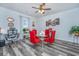 Bright dining area showcasing a modern glass table, red chairs, and elegant decor at 224 Hayworth Rd, Summerville, SC 29486