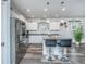 Modern kitchen with stainless steel appliances, a large island, and stylish pendant lighting at 224 Hayworth Rd, Summerville, SC 29486