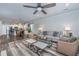 Open living area with a ceiling fan, gray sofa, and view to the kitchen at 224 Hayworth Rd, Summerville, SC 29486