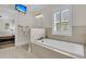 Elegant bathroom featuring a bathtub, tv, and natural light at 2269 Hartfords Bluff Cir, Mount Pleasant, SC 29466