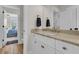 Bright bathroom featuring a marble countertop, modern fixtures, and seamless flow to the bedroom at 2269 Hartfords Bluff Cir, Mount Pleasant, SC 29466