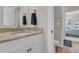 Bright bathroom featuring a marble countertop, modern fixtures, and seamless flow to the bedroom at 2269 Hartfords Bluff Cir, Mount Pleasant, SC 29466