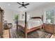 Cozy bedroom with a decorative rug and a balcony overlooking the outside at 2269 Hartfords Bluff Cir, Mount Pleasant, SC 29466