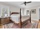 Spacious bedroom featuring a four-poster bed, ceiling fan and ample natural light at 2269 Hartfords Bluff Cir, Mount Pleasant, SC 29466