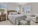 Inviting bedroom featuring a comfortable bed, stylish decor, and shuttered windows for natural light at 2269 Hartfords Bluff Cir, Mount Pleasant, SC 29466