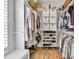 Walk-in closet with shelving and built-in storage for clothing and shoes at 2269 Hartfords Bluff Cir, Mount Pleasant, SC 29466