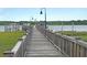 Picturesque community dock extending into the water, ideal for boating and enjoying waterfront views at 2269 Hartfords Bluff Cir, Mount Pleasant, SC 29466