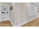 Hallway with wood floors and white paneled wall at 2269 Hartfords Bluff Cir, Mount Pleasant, SC 29466