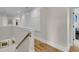 Hallway with wood floors and white paneled wall at 2269 Hartfords Bluff Cir, Mount Pleasant, SC 29466