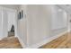 Hallway with wood floors and white paneled wall at 2269 Hartfords Bluff Cir, Mount Pleasant, SC 29466