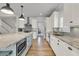 Bright kitchen with stainless steel appliances, sleek gray backsplash, and ample countertop space at 2269 Hartfords Bluff Cir, Mount Pleasant, SC 29466