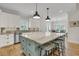 Bright kitchen with a large center island, stainless steel appliances, and classic white cabinetry at 2269 Hartfords Bluff Cir, Mount Pleasant, SC 29466