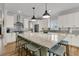 Spacious kitchen featuring a large granite island, ample cabinet space, and modern lighting fixtures at 2269 Hartfords Bluff Cir, Mount Pleasant, SC 29466