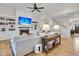 Inviting living room with a fireplace, built-in shelves, hardwood floors, and staircase access at 2269 Hartfords Bluff Cir, Mount Pleasant, SC 29466