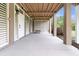 Outdoor patio with a wood-beamed ceiling at 2269 Hartfords Bluff Cir, Mount Pleasant, SC 29466
