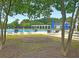 Community pool with lounge chairs and tables at 2269 Hartfords Bluff Cir, Mount Pleasant, SC 29466