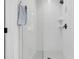 Sleek walk-in shower showcasing pristine white subway tiles and modern fixtures at 2269 Hartfords Bluff Cir, Mount Pleasant, SC 29466
