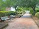 Scenic brick path with benches, providing a peaceful retreat within the community at 2269 Hartfords Bluff Cir, Mount Pleasant, SC 29466
