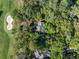 Overhead aerial view of a house with skylights, surrounded by lush greenery and a golf course at 2355 Andell Way, Seabrook Island, SC 29455