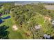 Overhead view of golf course community showing lush trees, ponds, and scenic views at 2355 Andell Way, Seabrook Island, SC 29455