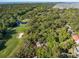 Aerial view showcasing a house nestled among lush greenery, close to golf course and marsh at 2355 Andell Way, Seabrook Island, SC 29455