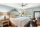 A beautifully staged bedroom offers serene decor, natural light, and hardwood floors at 2355 Andell Way, Seabrook Island, SC 29455