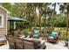 Spacious outdoor deck with patio furniture, barbecue grill, and lush backyard at 2355 Andell Way, Seabrook Island, SC 29455