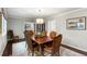 Formal dining room featuring a wood table, decorative chairs, a chandelier, and hardwood floors at 2355 Andell Way, Seabrook Island, SC 29455
