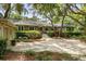 Charming single-story home featuring manicured landscaping and a spacious driveway at 2355 Andell Way, Seabrook Island, SC 29455
