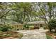 Charming single-story home with a landscaped front yard and a detached two-car garage at 2355 Andell Way, Seabrook Island, SC 29455