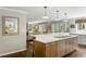 Well-appointed kitchen island with bar stool seating overlooking the open living area at 2355 Andell Way, Seabrook Island, SC 29455