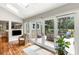 Bright sunroom with hardwood floors, skylights, and sliding glass doors leading to a deck with outdoor seating at 2355 Andell Way, Seabrook Island, SC 29455