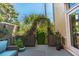 Cozy back porch with lush garden at 24 Archdale St, Charleston, SC 29401