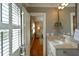 Well lit bathroom with a vanity, mirror, and view into the bedroom at 24 Archdale St, Charleston, SC 29401