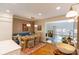 Dining room with modern lighting open to living room at 24 Archdale St, Charleston, SC 29401