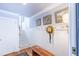 Traditional entryway with paneled walls, hardwood floors, bench and stairway at 24 Archdale St, Charleston, SC 29401