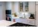 Modern kitchen showcases marble countertops, stainless steel appliances, and bright white cabinetry at 24 Archdale St, Charleston, SC 29401