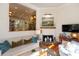 Cozy living room with hardwood floors, fireplace, and a view into an adjacent room at 24 Archdale St, Charleston, SC 29401