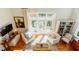 Sun-filled living room features French doors to private deck at 24 Archdale St, Charleston, SC 29401